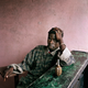 LIBERIA. Tubmanburg. June 16th, 2003. Young rebel fighter and hand grenade.